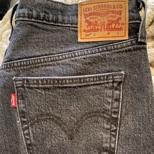 Black Levi’s vintage jeans with distressed bottom